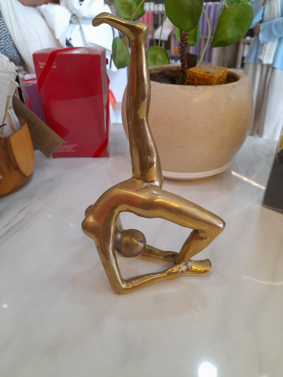 Handmade gold brass Backbend LU yoga pose statue at Yoga Republik Canggu Bali
