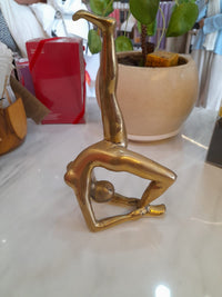 Handmade gold brass Backbend LU yoga pose statue at Yoga Republik Canggu Bali