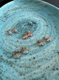 See No Evil Turkish evil eye gold stud earrings at Yoga Republik Canggu Bali