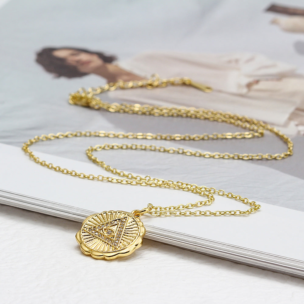 See No Evil gold triangle evil eye pendant chain at Yoga Republik Canggu Bali