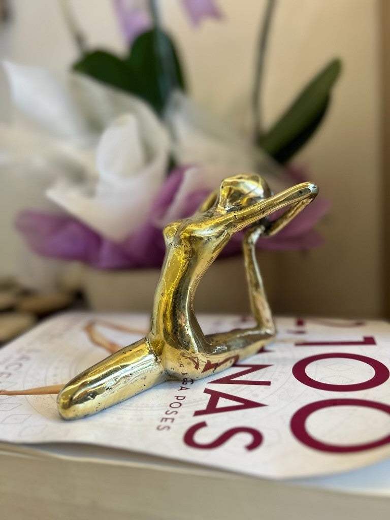Handmade gold brass Side Bend yoga pose statue at Yoga Republik Bali