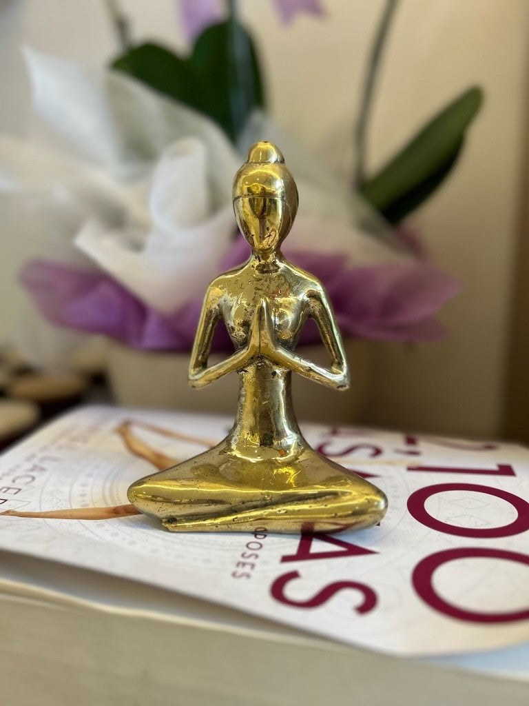 Handmade gold brass Namaste yoga pose statue at Yoga Republik Canggu Bali