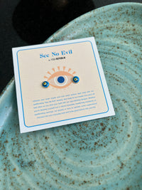 See No Evil Turkish evil eye gold stud earrings at Yoga Republik Canggu Bali